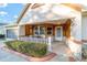 Inviting front porch with wooden accents and comfortable seating at 8961 Sw 94Th Ln # C, Ocala, FL 34481