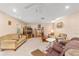 Spacious living room featuring neutral color palette and ample seating at 8961 Sw 94Th Ln # C, Ocala, FL 34481