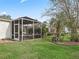 Screened patio and nicely landscaped backyard at 9203 Se 179Th Lunsford Ln, The Villages, FL 32162