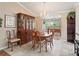 Formal dining room with hardwood floors and a chandelier at 9203 Se 179Th Lunsford Ln, The Villages, FL 32162