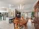 Elegant dining room with a chandelier and hardwood floors at 9203 Se 179Th Lunsford Ln, The Villages, FL 32162