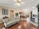 Open living room with hardwood floors and views to dining area and kitchen at 9203 Se 179Th Lunsford Ln, The Villages, FL 32162