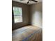 Bright bedroom with large window offering natural light and outside view at 10538 Se 50Th Ave, Belleview, FL 34420