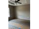 Bedroom featuring tray ceiling, ceiling fan, and carpet flooring ready for your personal touches at 10538 Se 50Th Ave, Belleview, FL 34420