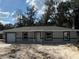 Charming single-story home featuring a neutral color scheme and an attached single car garage at 10538 Se 50Th Ave, Belleview, FL 34420