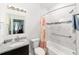 Bathroom featuring granite countertops, tile flooring, and a shower/tub combo at 10871 Sw 62Nd Avenue Rd, Ocala, FL 34476