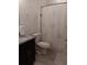 Modern bathroom featuring dark vanity and shower at 10871 Sw 62Nd Avenue Rd, Ocala, FL 34476