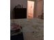 Bedroom with a double bed, dresser, and view of the bathroom at 10871 Sw 62Nd Avenue Rd, Ocala, FL 34476