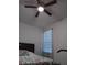 Spacious bedroom with ceiling fan and large bed at 10871 Sw 62Nd Avenue Rd, Ocala, FL 34476