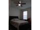 Bedroom with a queen bed and ceiling fan at 10871 Sw 62Nd Avenue Rd, Ocala, FL 34476