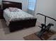Bedroom with fitness equipment and large bed at 10871 Sw 62Nd Avenue Rd, Ocala, FL 34476