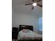 Spacious bedroom with ceiling fan and large bed at 10871 Sw 62Nd Avenue Rd, Ocala, FL 34476