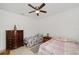 Bedroom featuring two twin beds, tiled floors, and neutral wall paint at 10871 Sw 62Nd Avenue Rd, Ocala, FL 34476