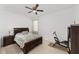 Bright bedroom featuring tiled floor, neutral walls, and ceiling fan at 10871 Sw 62Nd Avenue Rd, Ocala, FL 34476