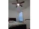 Spacious bedroom with ceiling fan and large bed at 10871 Sw 62Nd Avenue Rd, Ocala, FL 34476