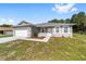 Lovely single-story home with a two-car garage, a neat front yard, and a welcoming entrance at 10871 Sw 62Nd Avenue Rd, Ocala, FL 34476