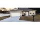 One-story house with gray roof, white garage door, and landscaped yard at 10871 Sw 62Nd Avenue Rd, Ocala, FL 34476