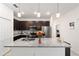 Stylish kitchen island with granite countertops, pendant lighting and modern appliances at 10871 Sw 62Nd Avenue Rd, Ocala, FL 34476