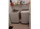 Bright laundry room with washer, dryer, and shelving at 10871 Sw 62Nd Avenue Rd, Ocala, FL 34476