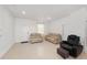 Bright living room featuring neutral tile flooring and comfortable seating at 10871 Sw 62Nd Avenue Rd, Ocala, FL 34476