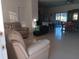 Spacious living room with tile floors and adjacent dining area at 10871 Sw 62Nd Avenue Rd, Ocala, FL 34476