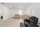 Bright living room featuring neutral tile flooring and comfortable seating at 10871 Sw 62Nd Avenue Rd, Ocala, FL 34476