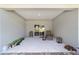 Covered patio with a view of the lawn and a sliding glass door to the interior at 10871 Sw 62Nd Avenue Rd, Ocala, FL 34476