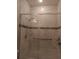 Clean shower with marble tile and grab bar at 10871 Sw 62Nd Avenue Rd, Ocala, FL 34476
