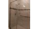 Clean shower with marble tile and grab bar at 10871 Sw 62Nd Avenue Rd, Ocala, FL 34476