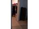 Walk-in closet with hanging clothes and shelves at 10871 Sw 62Nd Avenue Rd, Ocala, FL 34476