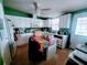 Bright kitchen with white cabinets and an island at 1628 Bay Meadows Ln, The Villages, FL 32159
