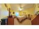 Bright bedroom with double bed and wood furniture at 17096 Se 96Th Chapelwood Cir, The Villages, FL 32162