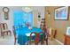 Bright dining room with a table for six and access to a patio at 17096 Se 96Th Chapelwood Cir, The Villages, FL 32162