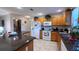 Spacious kitchen featuring granite countertops and ample wood cabinetry at 17096 Se 96Th Chapelwood Cir, The Villages, FL 32162