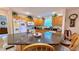 Kitchen features granite countertop island and wood cabinets at 17096 Se 96Th Chapelwood Cir, The Villages, FL 32162