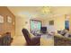 Comfortable living room with a recliner, sofa, and TV at 17096 Se 96Th Chapelwood Cir, The Villages, FL 32162