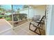 Relaxing screened-in porch with seating area at 17096 Se 96Th Chapelwood Cir, The Villages, FL 32162