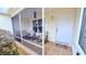 Cozy screened porch with seating, perfect for relaxing outdoors at 17096 Se 96Th Chapelwood Cir, The Villages, FL 32162