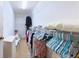 Spacious walk-in closet with ample shelving and storage space for clothes and accessories at 17096 Se 96Th Chapelwood Cir, The Villages, FL 32162