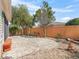 Backyard view with brick patio, trees, and landscaping at 17163 Se 76Th Boxbury Ct, The Villages, FL 32162