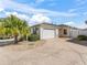 Charming home with a well-maintained yard and a two-car garage and beautiful blue skies at 17163 Se 76Th Boxbury Ct, The Villages, FL 32162