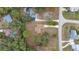 House with surrounding landscape and street view from above at 19699 Sw 88Th Place Rd, Dunnellon, FL 34432