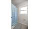 Simple bathroom with shower and window at 19699 Sw 88Th Place Rd, Dunnellon, FL 34432