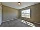 Well-lit bedroom with carpet and a window offering natural light at 20 Fisher Trail Pass, Ocklawaha, FL 32179
