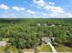 Wide aerial showcasing the property's expansive lot and rural setting at 22777 Sw Surf Blvd, Dunnellon, FL 34431