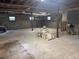 Spacious unfinished basement with exposed ceiling, support beams, and concrete flooring at 22777 Sw Surf Blvd, Dunnellon, FL 34431