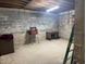 Basement with block walls, a desk, and work tools at 22777 Sw Surf Blvd, Dunnellon, FL 34431