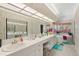 Large bathroom with double vanity, soaking tub and window at 22777 Sw Surf Blvd, Dunnellon, FL 34431