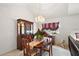 Elegant dining room with chandelier, oval table, and hardwood floors at 22777 Sw Surf Blvd, Dunnellon, FL 34431