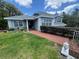 Charming single-Gathering home featuring tidy landscaping and classic architectural details at 22777 Sw Surf Blvd, Dunnellon, FL 34431